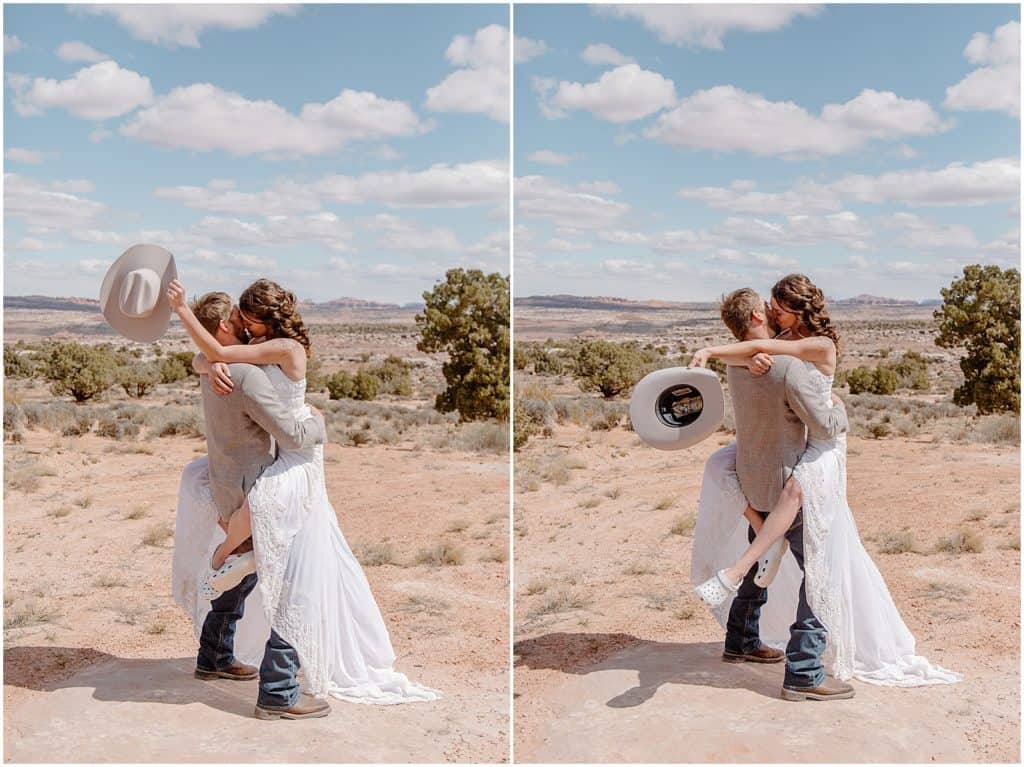 bride holding grooms cowboy hat while groom picks her up for Arches National Park Elopement picture