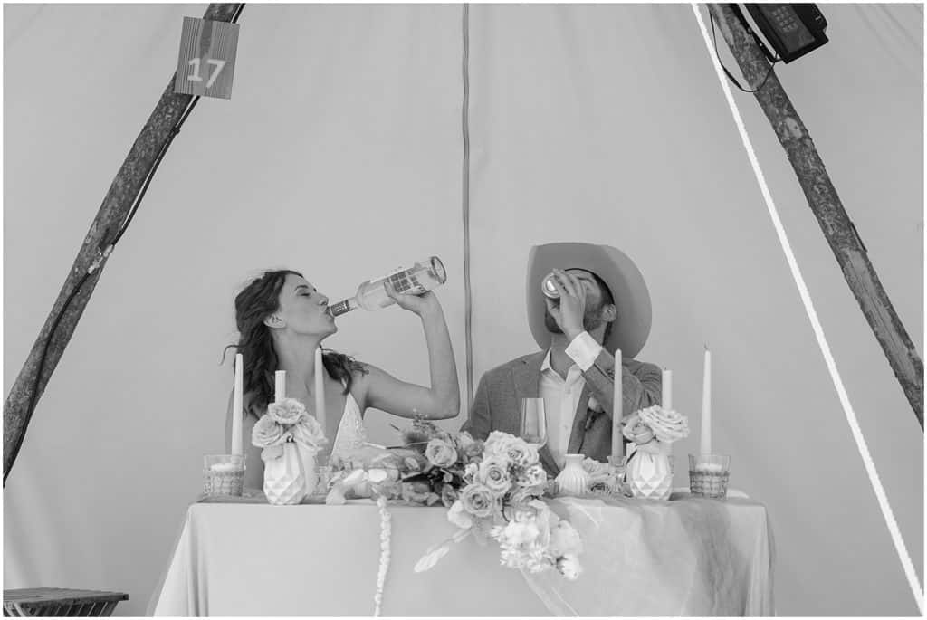 bride and groom drinking