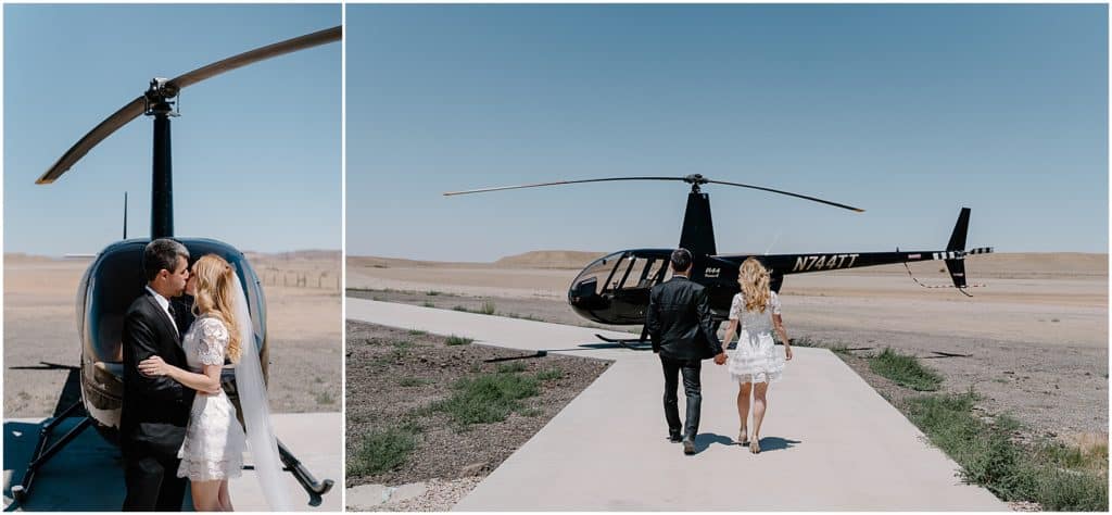 couple kissing in front of helicopter and walking towards it. on their way to the canyonlands for their moab elopement photoshoot.