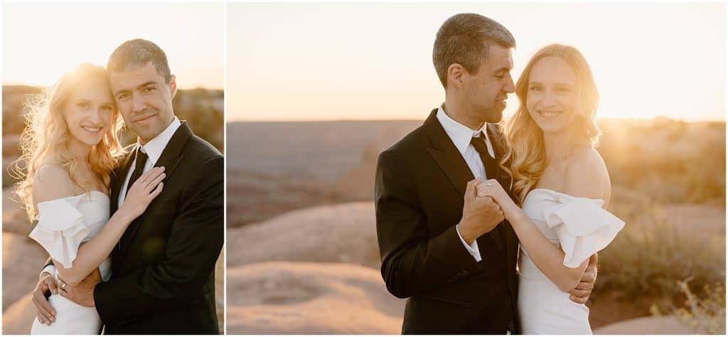 couple smiling at the camera with the golden sunset. in the background, moab elopement day