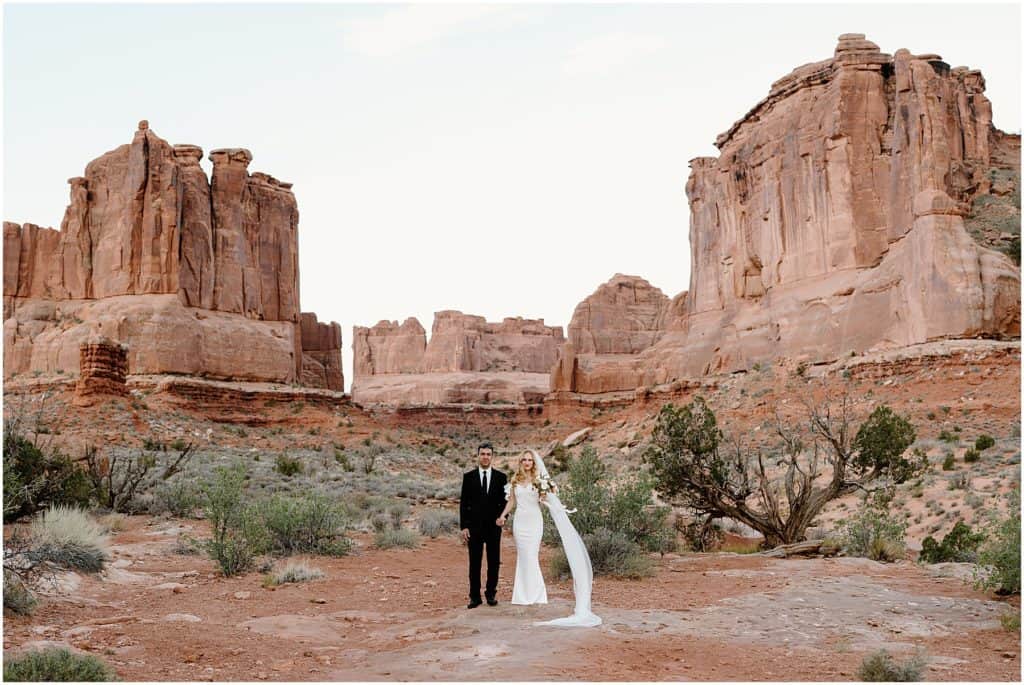 couple after their first look in moab for their elopement. up close to camera.