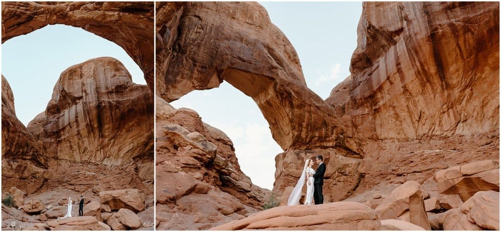 bride and groom in front of arch. on rock in moab for their elopement.