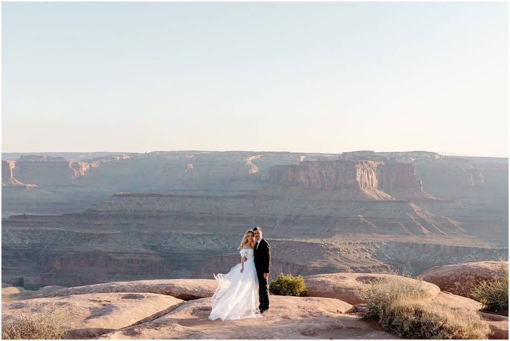 the most beautiful canyonlands behind the couple
