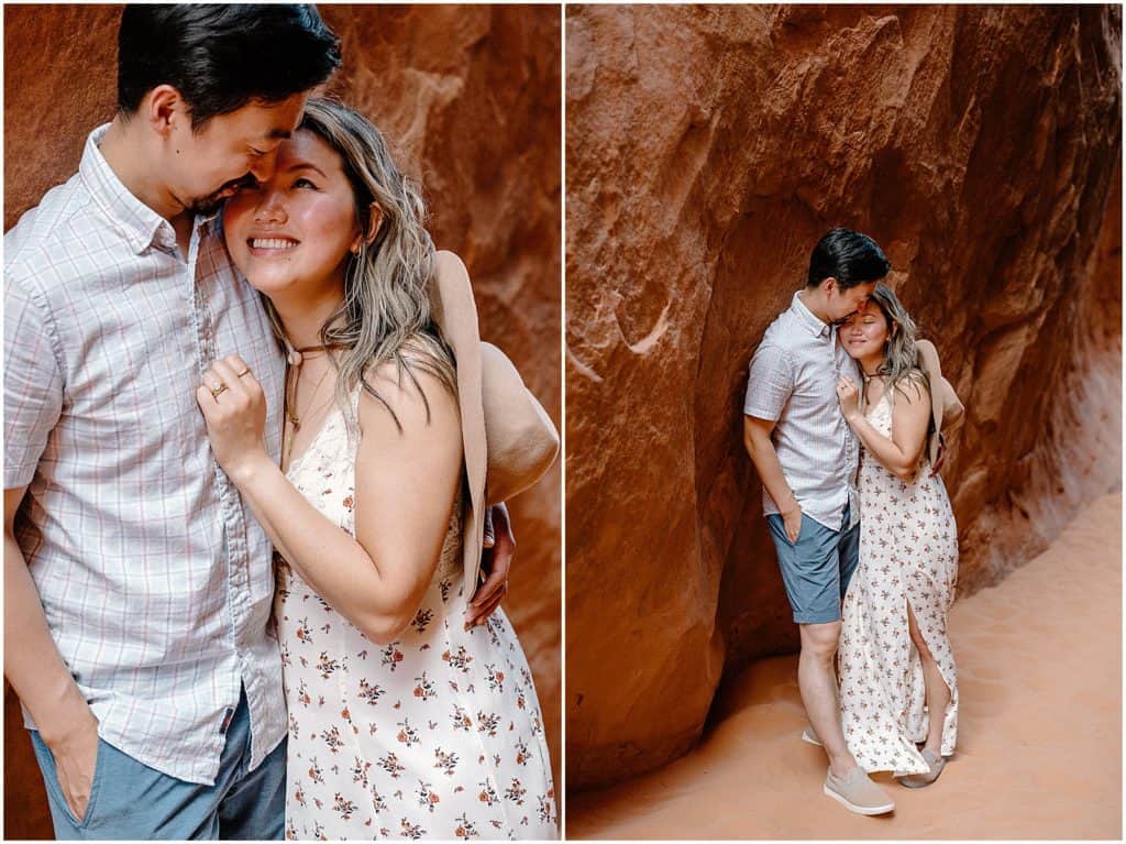 couple in front of rock wall in utah