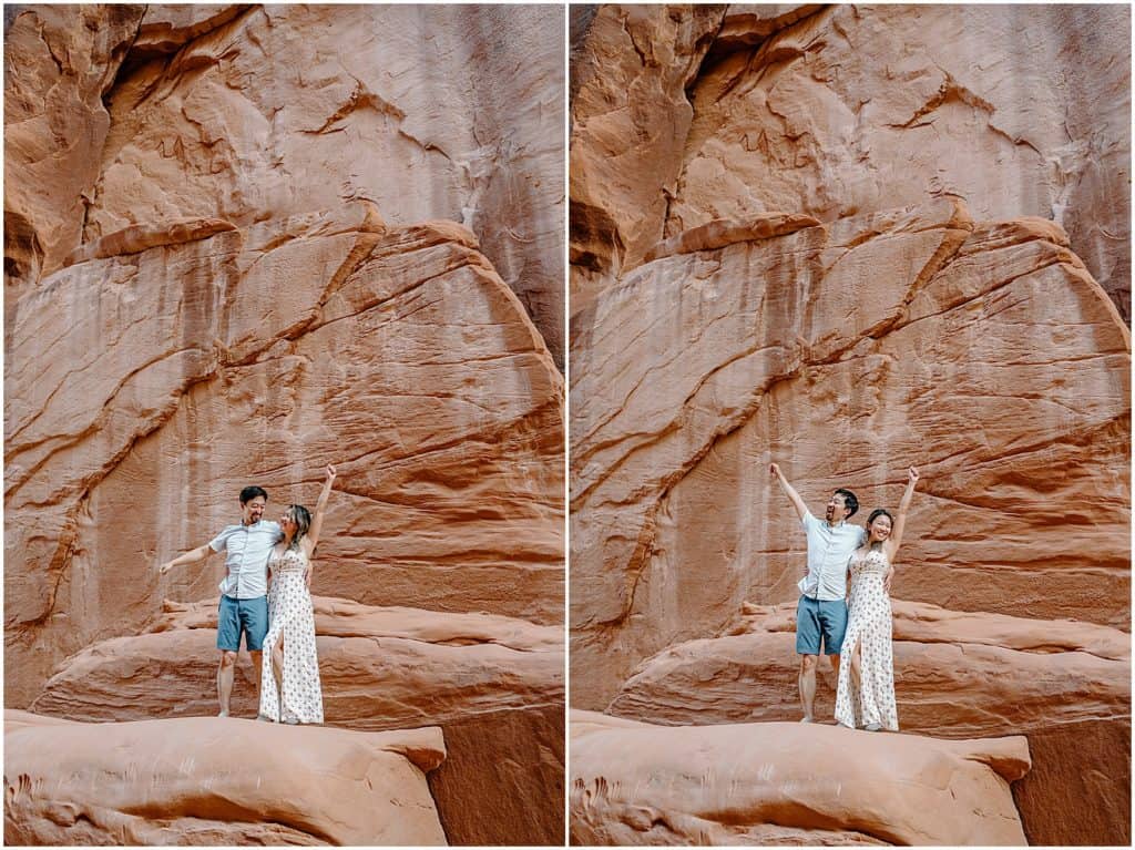 couple in front of rock wall in utah