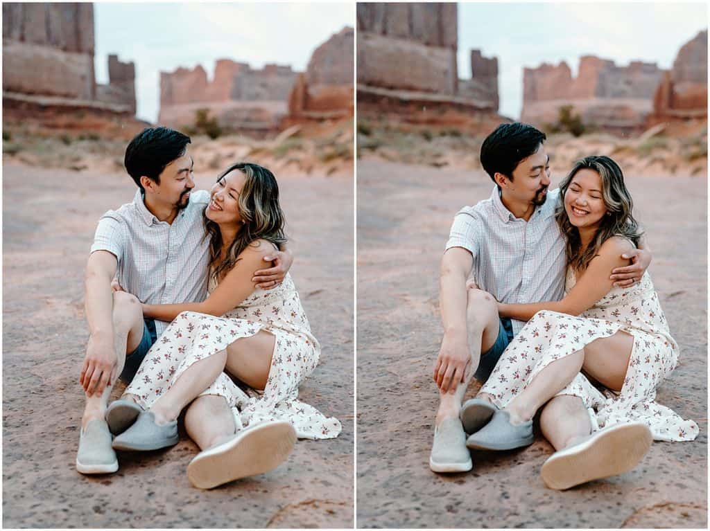 Couple seen in the front with the background blurry on their Arches National Park Adventure Session