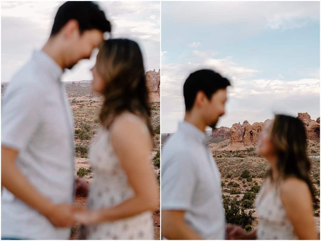 couple seen blurry in the front on their Arches National Park Adventure Session