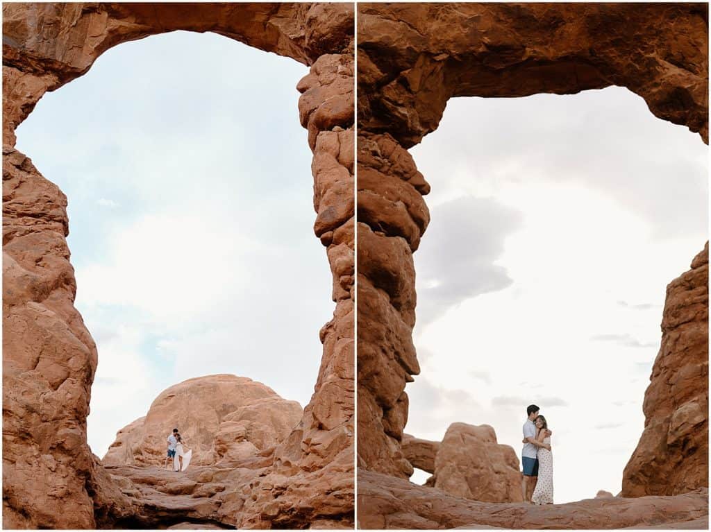 couple under slot canyon in utah on their adventure session in the arches national park