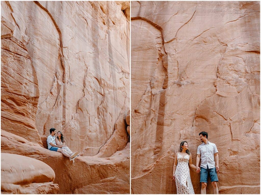 couple in front of rock wall in utah