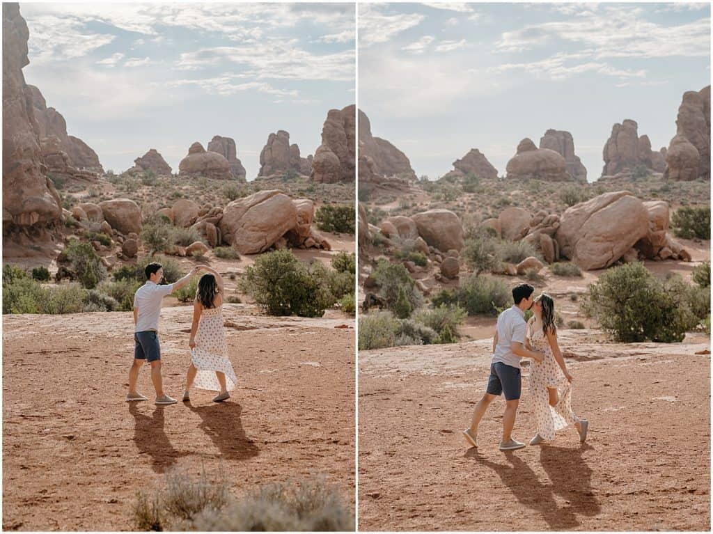 photo of couple twirling and smiling on their adventure session in the arches national park