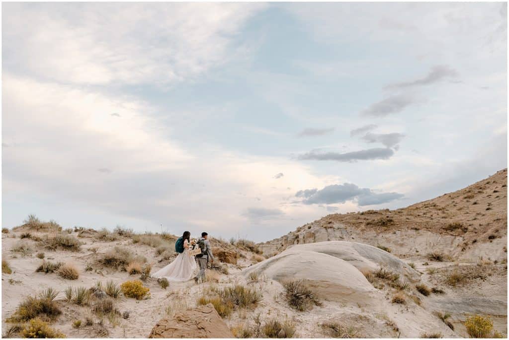 Southern Utah Elopement bride and groom hiking