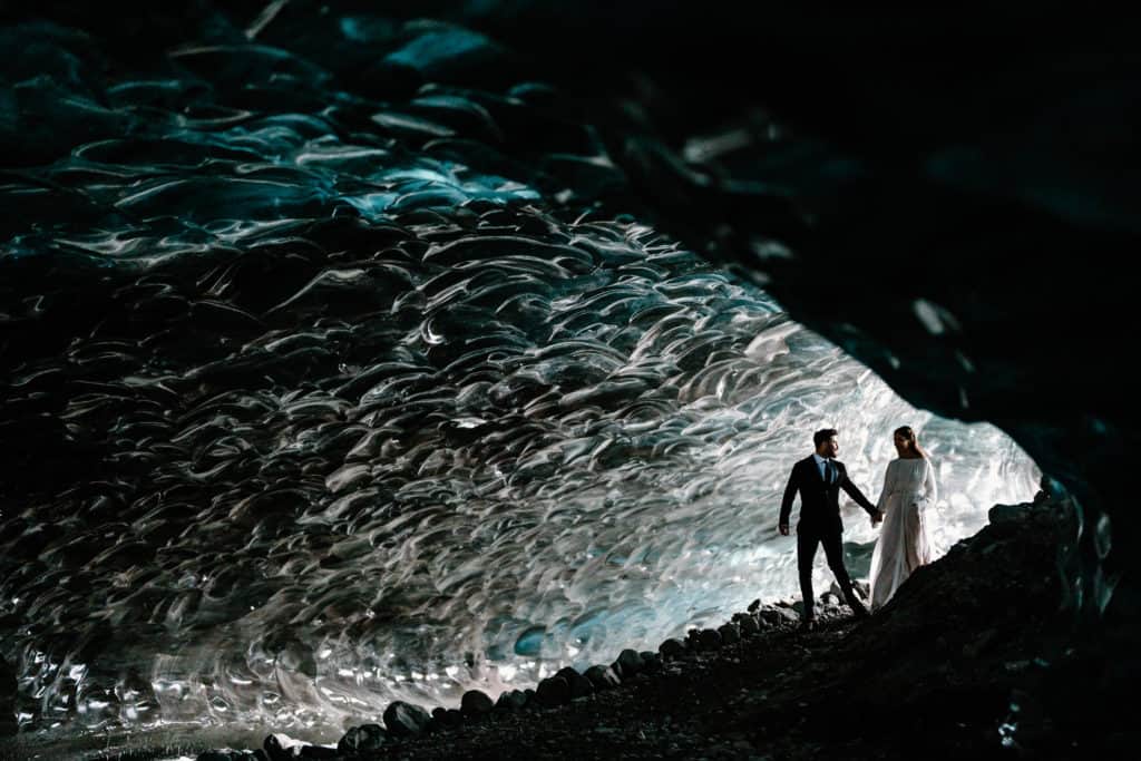 A couple explores an ice cave in Alaska on their elopement day. Why should couples consider eloping? They can have epic adventures like this.