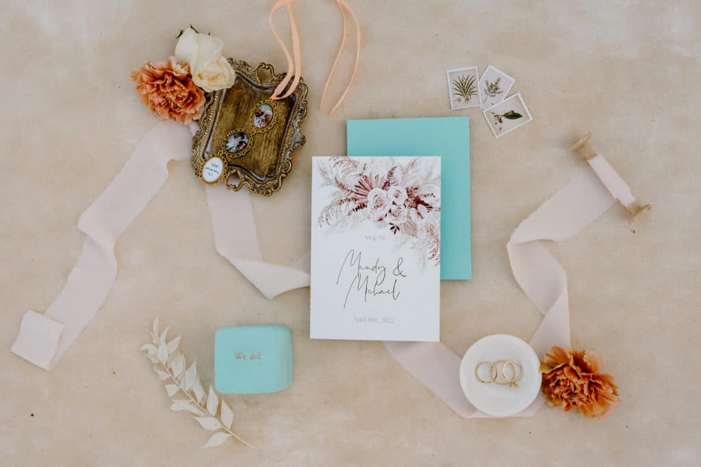Beautiful flat lays of a couple's elopement details are shown in this image from a Southern Utah elopement wedding.