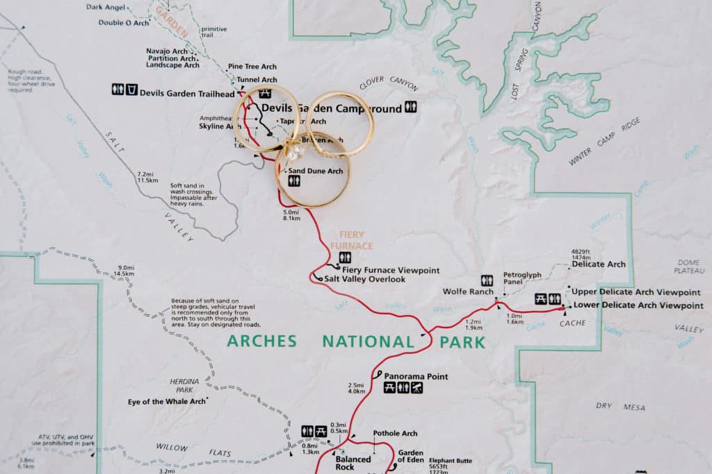 A couple's wedding rings outline the spot where they'll say their vows and have their elopement ceremony in Southern Utah.