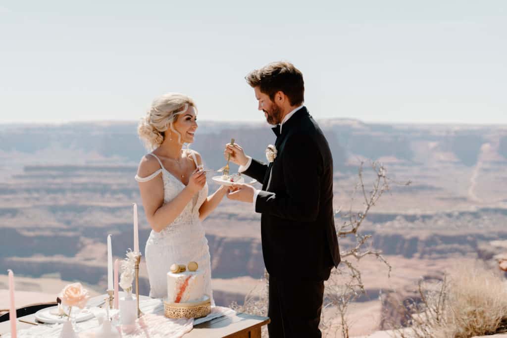 Bride and groom celebrate their marriage at a Southern Utah overlook during their Moab elopement ceremony.