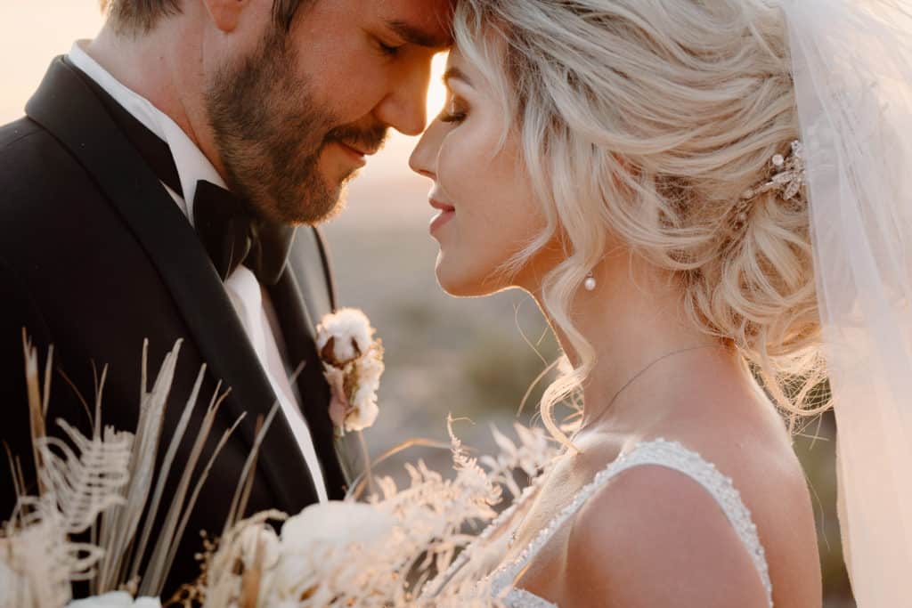 A bride and groom hold each other close as they experience a one of a kind Utah wedding elopement experience. 