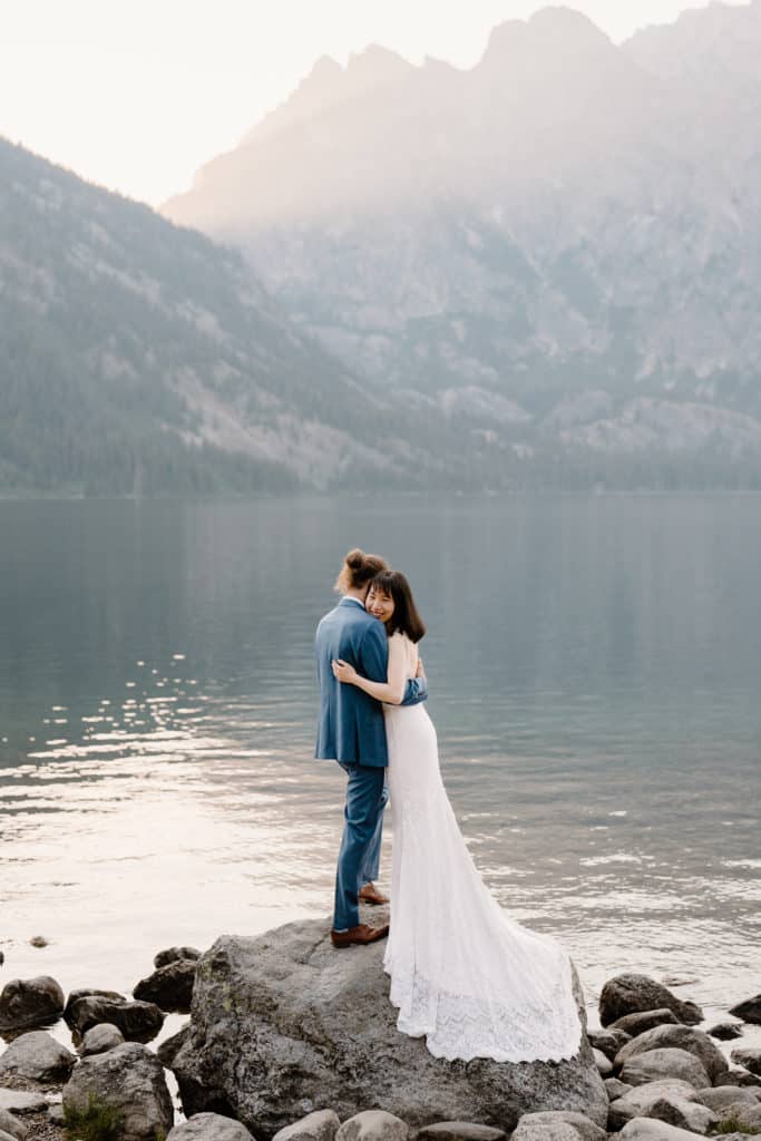 A bride and groom hold each other close during their mountain elopement as their elopement photographer captures their elopement photos. 