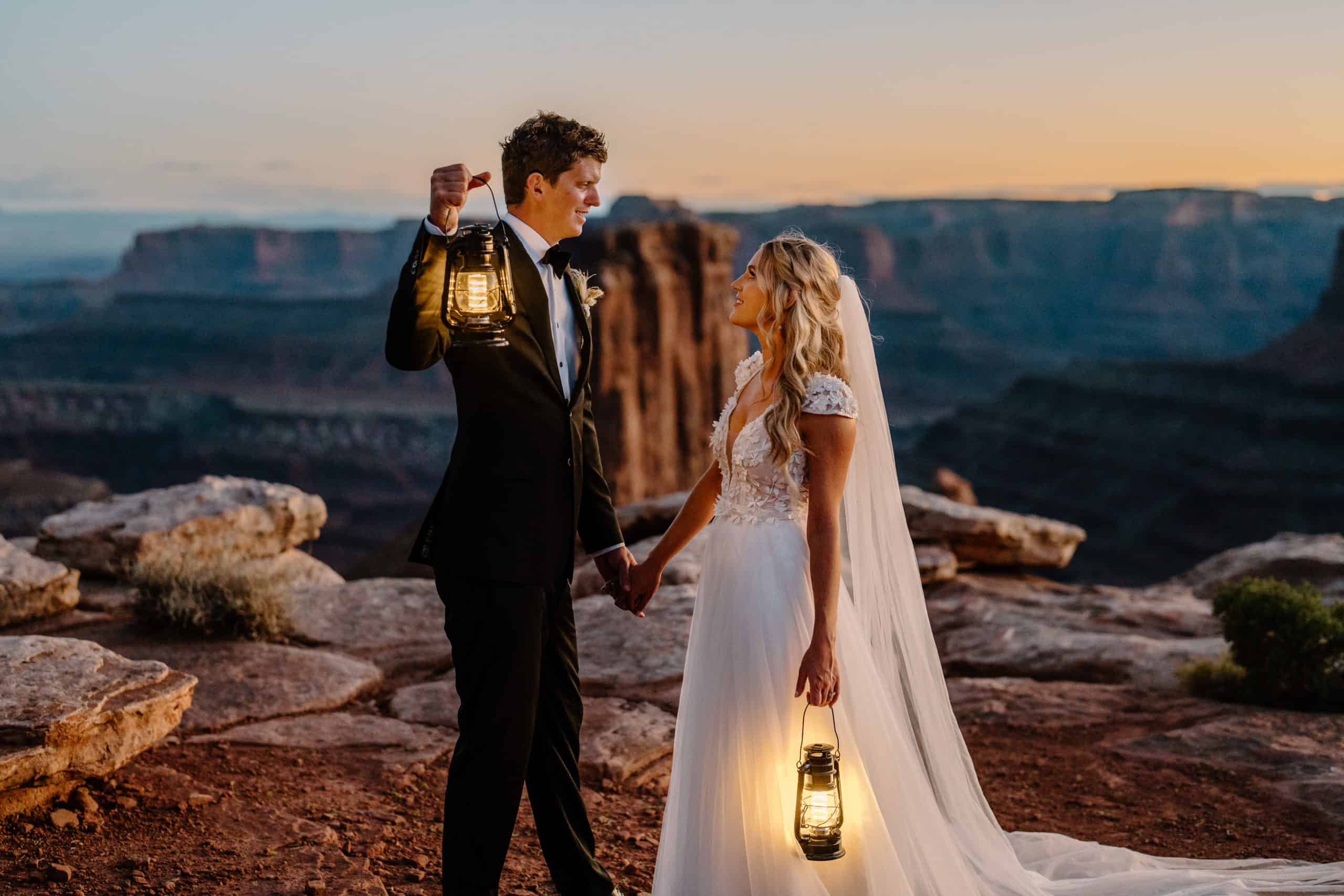 A couple experiences their elopement ceremony at the top of a canyon, including traditional wedding elements along the way.