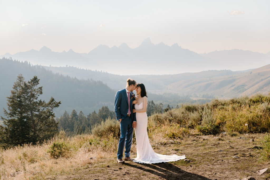 A bride and groom hold each other close during their Grand Teton National Park Elopement. 