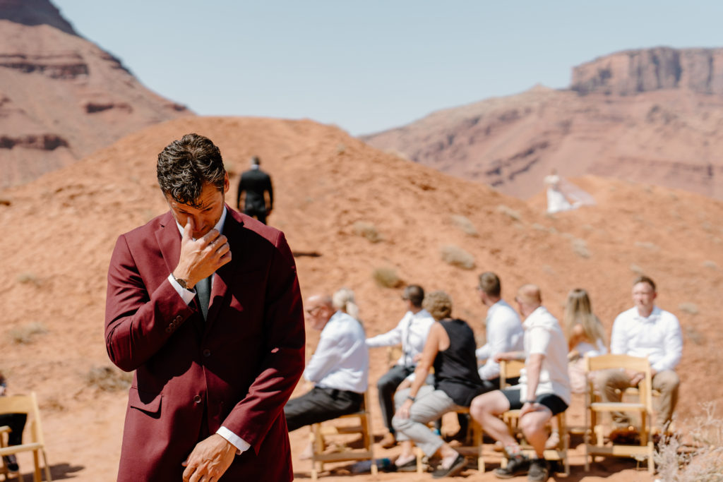 A groom awaits his bride to arrive for their elopement ceremony.