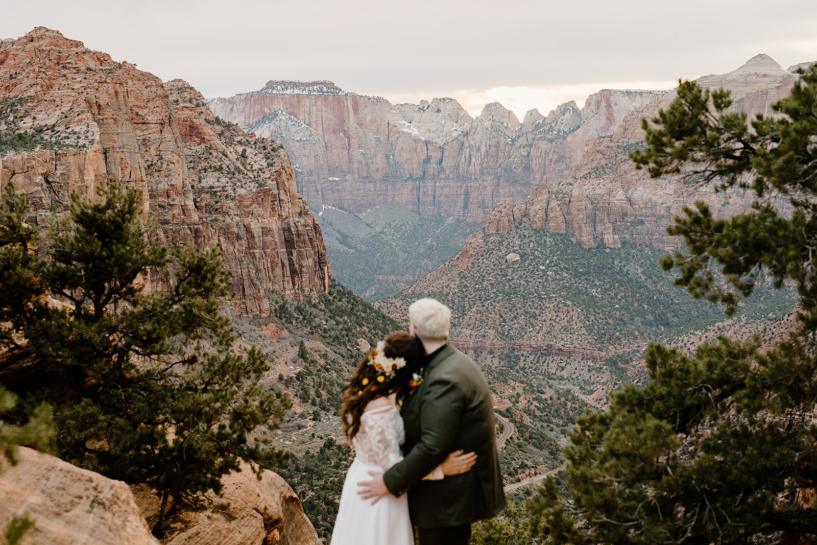 A couple looks out over Zion National Park during their Southern Utah elopement.