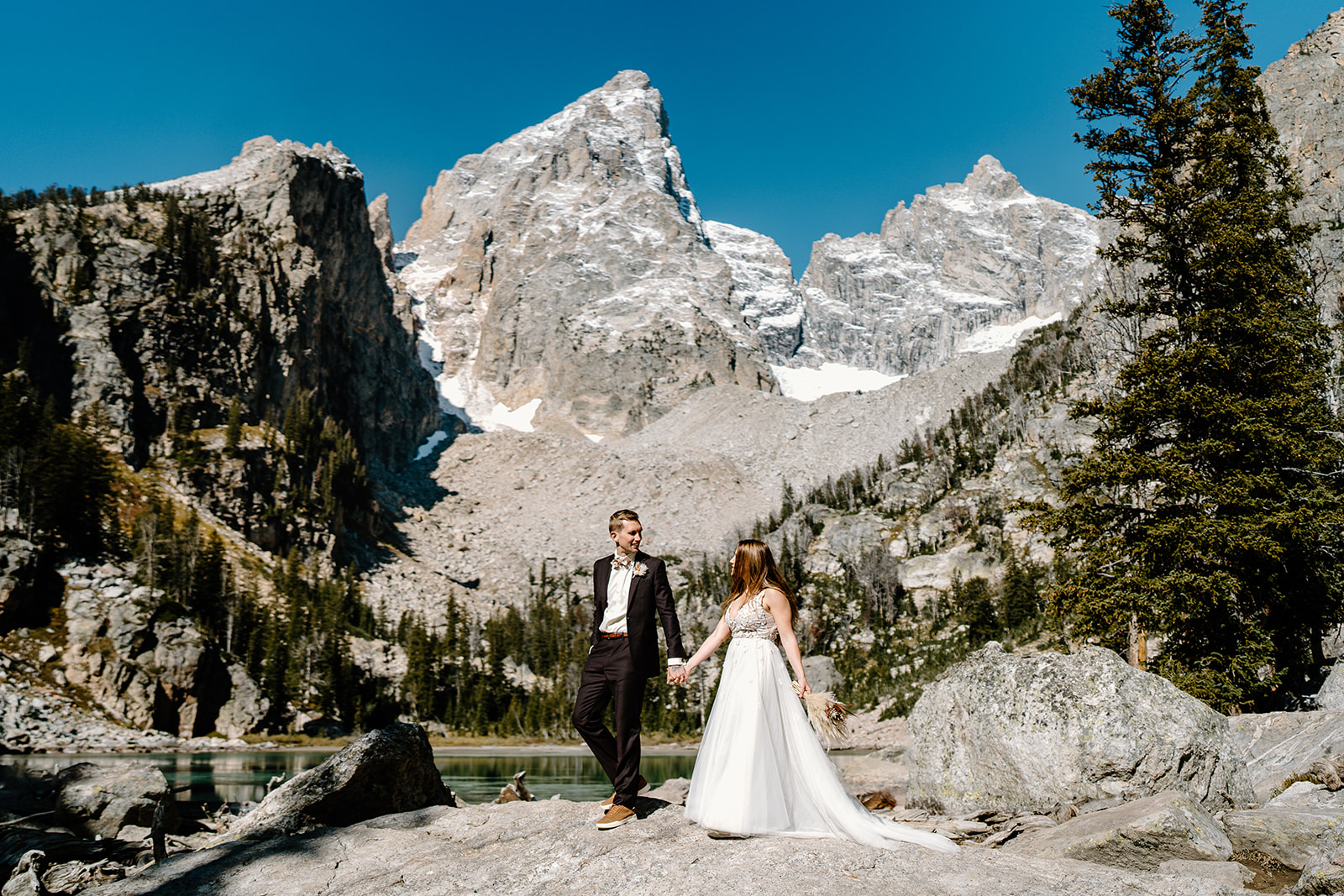 A bride and groom enjoy their hike during their two-day elopement package in the Tetons.
