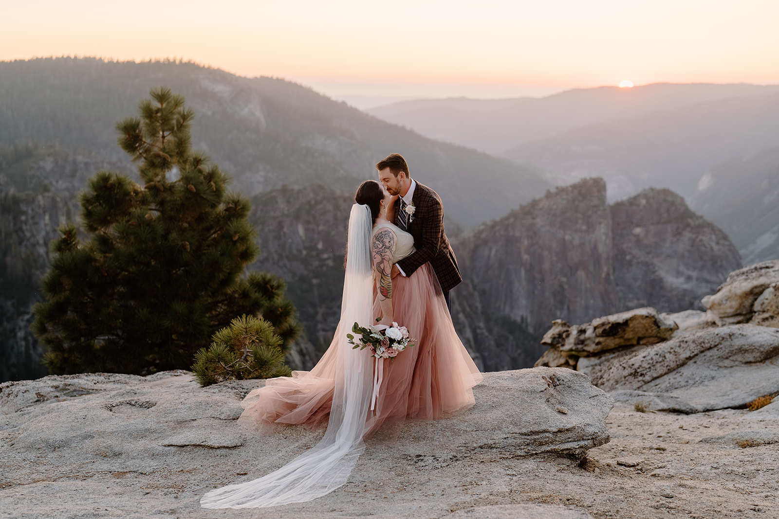 A young couple embraces during their Yosemite National Park elopement.