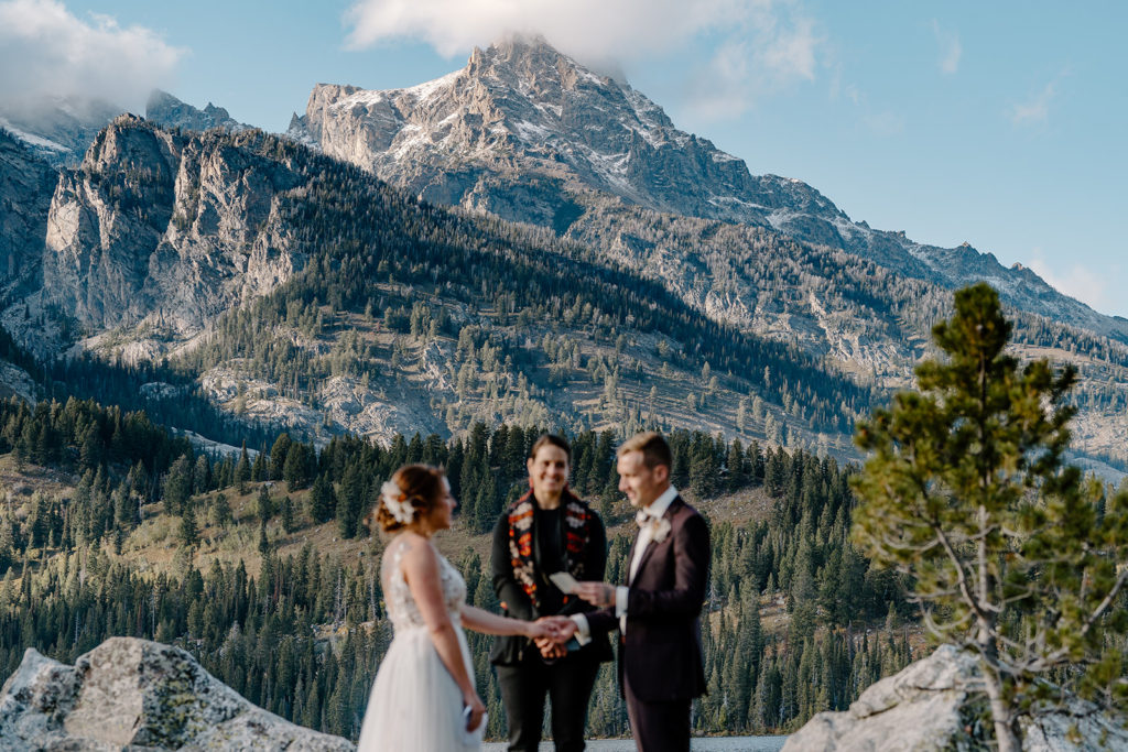 A couple gets married in the Tetons with a gorgeous mountain view during their all-day elopement. 